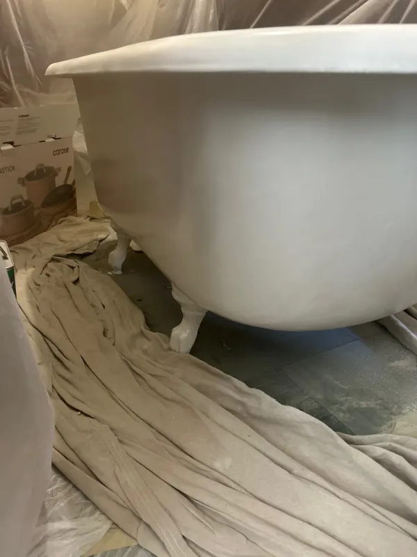 Exterior of clawfoot tub after refinishing with a white coating
