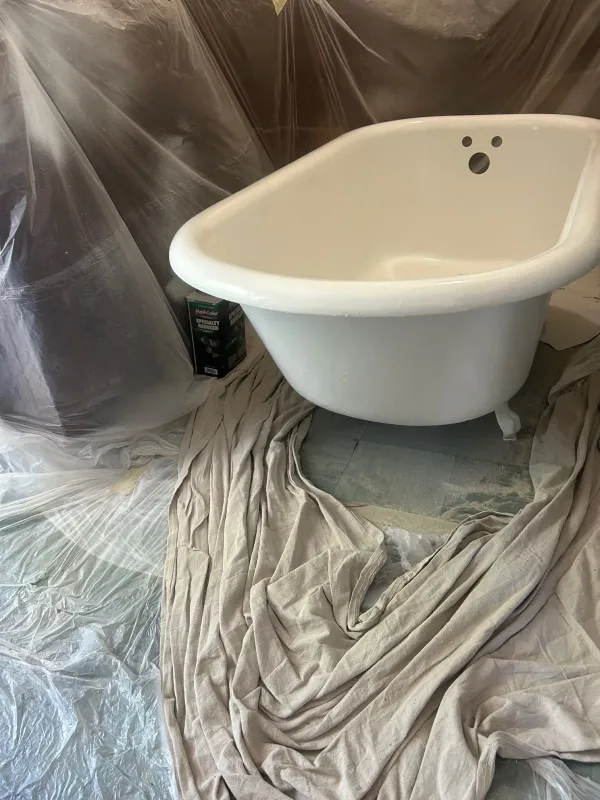 Freestanding tub after reglazing with a smooth white finish